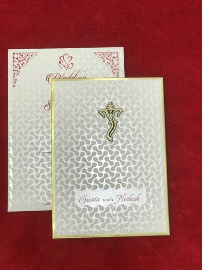 White embossed card with gold base