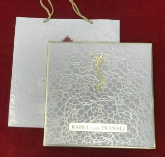 White embossed card with golden padding