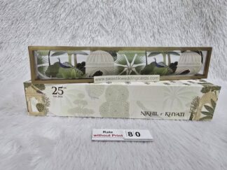 Plastic cube box with slider cover and paper scroll with design and golden foil work on it.