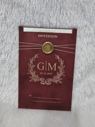 Premium mettalic paper wedding invitation card with plastic seal and golden thread. Plastic film and 2 mettalic inserts and a mettalic box cover.