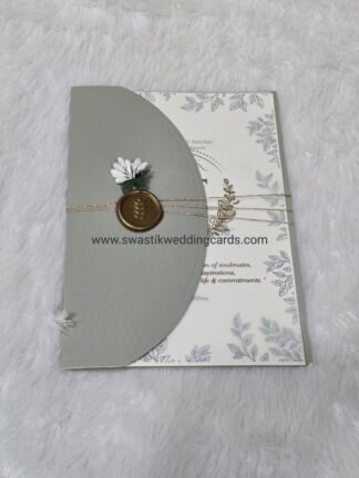 Premium quality matt finished card with plastic seal,artificial flower and golden thread along with 2 insert and box cover