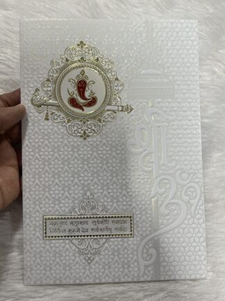 Folder style wedding invitation card with  ganesh and shlok along with cover.